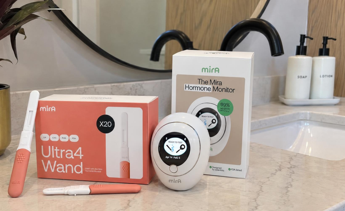 Ultra4 Wand box, Mira Hormone Monitor box, and the monitor on a bathroom counter